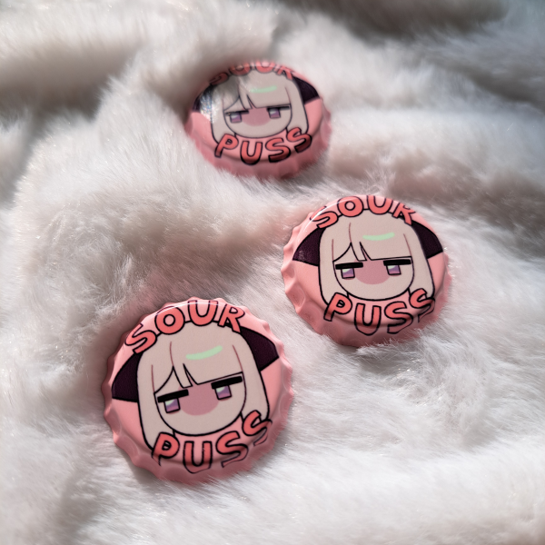 "SOUR PUSS" bottle cap badge