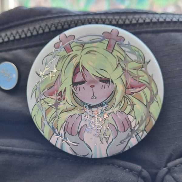 noelle silver holo foil badge